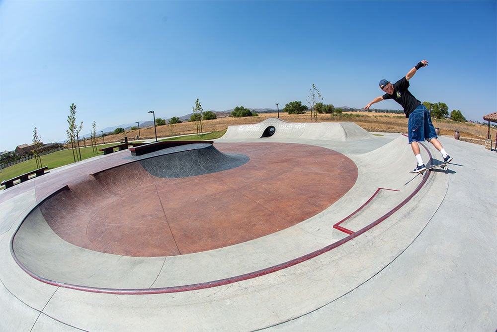 Backside Lip by Jake Wooten around the bowl of Perris Skatepark