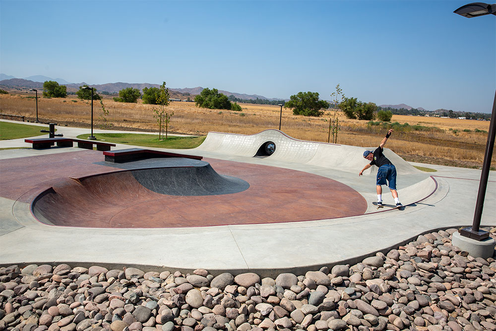 Backside Tail over the ledge at Perris Skatepark bowl