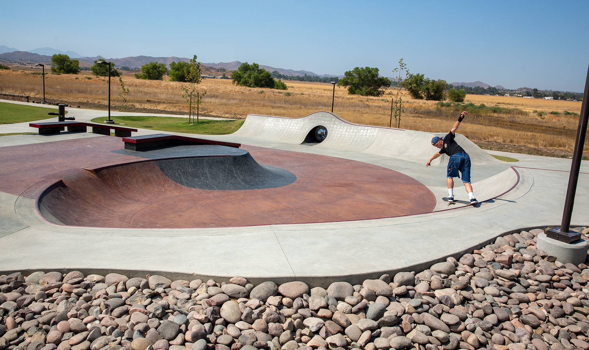 Backside Tail over the ledge at Perris Skatepark bowl