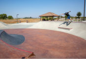 Backside Tail over the ledge at Perris Skatepark bowl