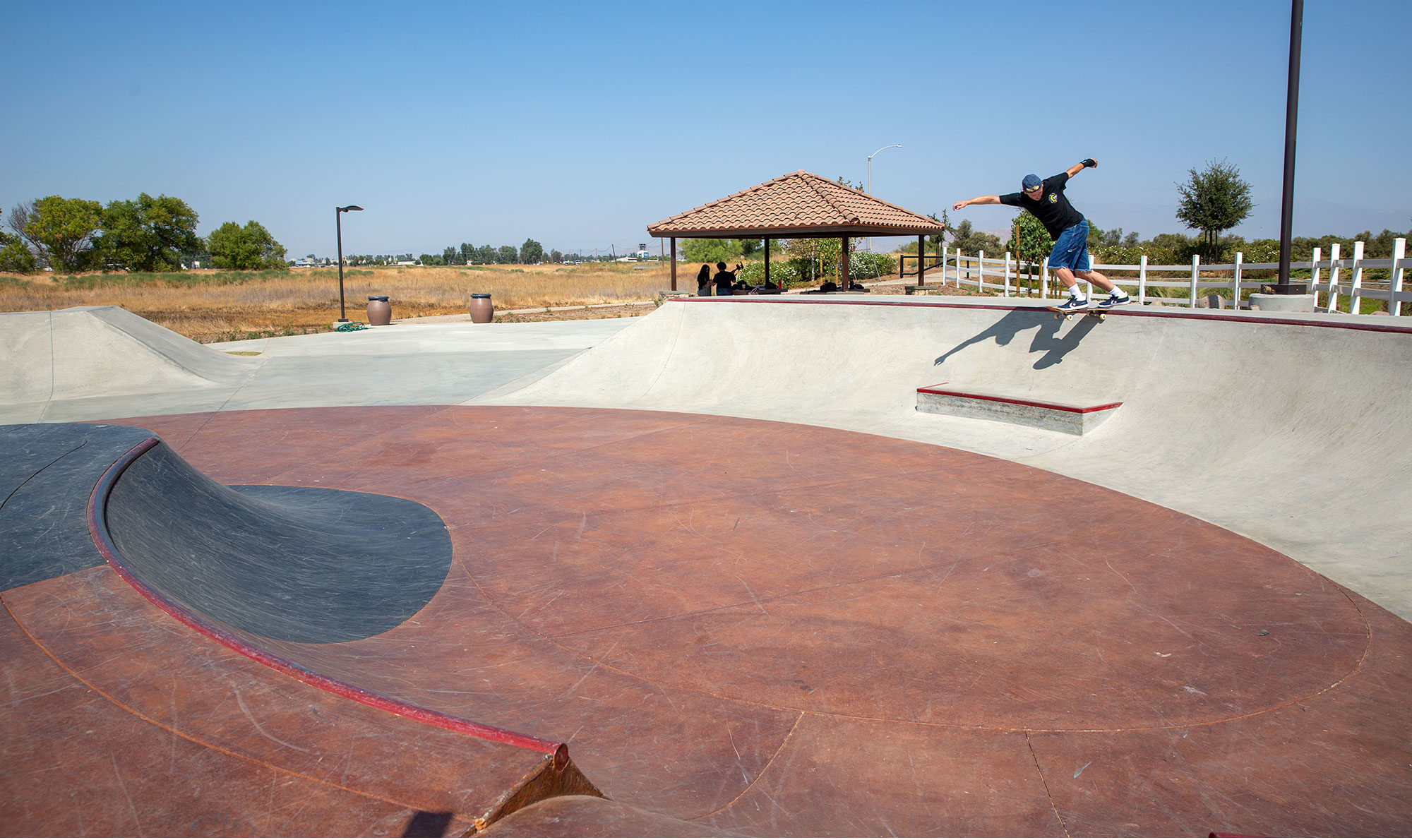 Backside Tail over the ledge at Perris Skatepark bowl