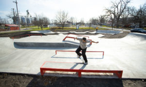 Frontcrooks on the orange skate able ledge, with flat bar and hubba at the skatepark