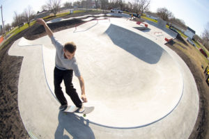 Carving around the skatepark bowl at Gibson City Skatepark in Illinois