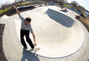 Carving around the skatepark bowl at Gibson City Skatepark in Illinois