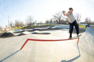 Designed and Built by Spohn Ranch showcases a frontside blunt skateboard trick in Gibson City