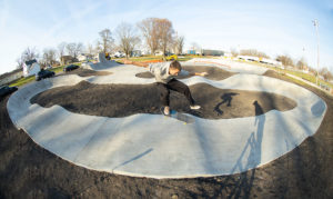 Kickflip on the pump track hips at Ed Day Memorial Skatepark and Pump Track in Gibson City, IL