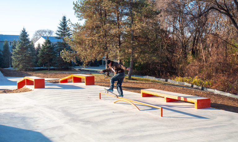 A frontside blunt side at a skatepark filled with Rails, Hubbas, Ledges, Transition, Volcano and tons of shade