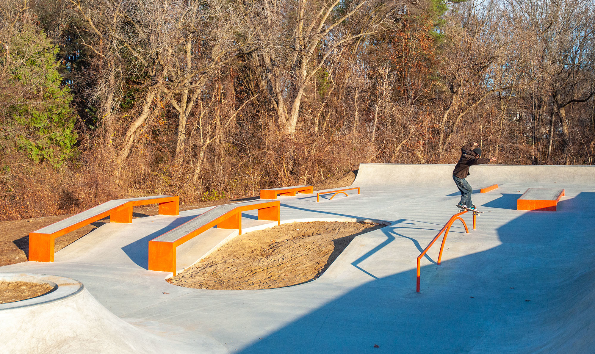 Frontside Feeble skatepark embedded in a forest designed and built by Spohn Ranch Skatepark Company