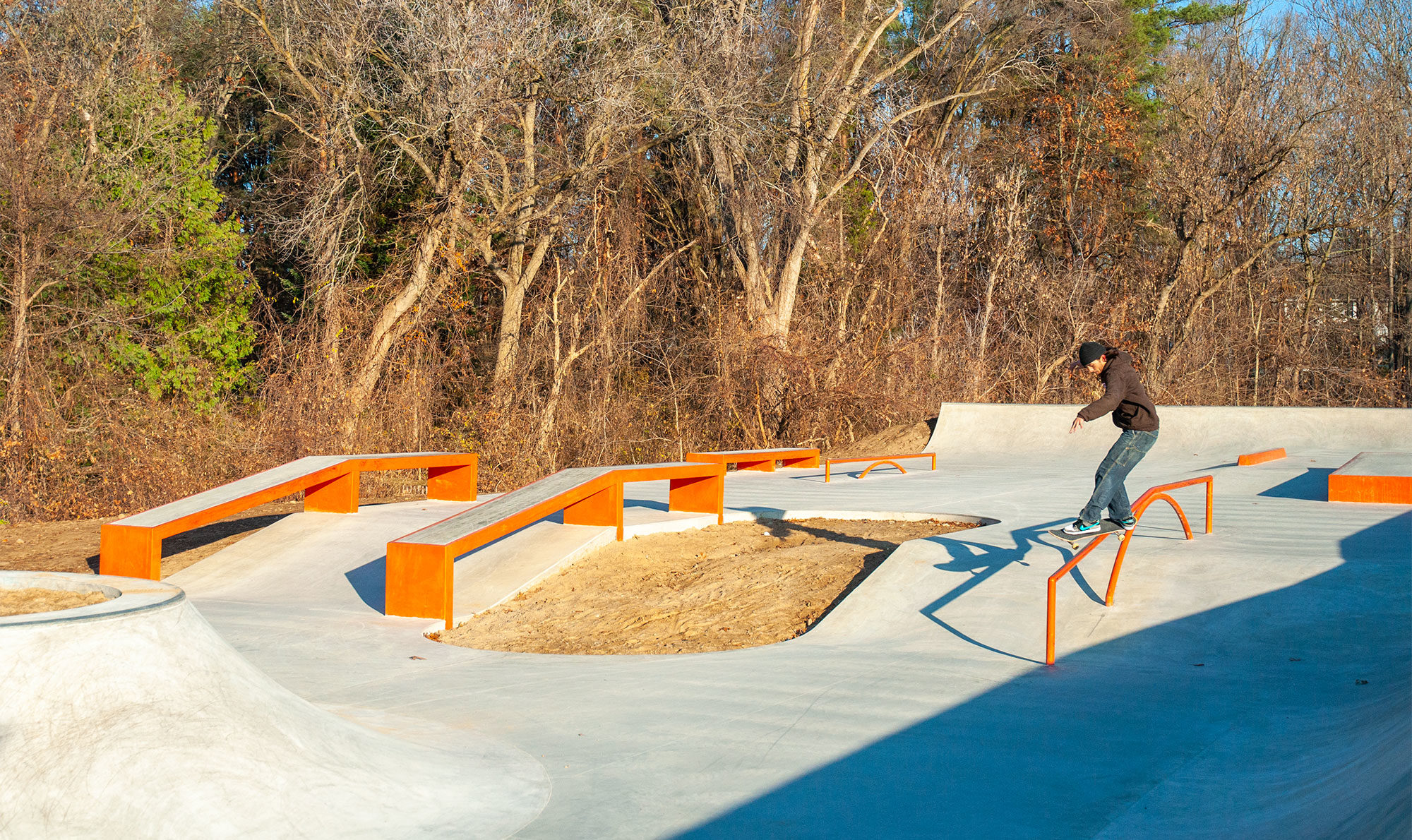 Treelined skatepark in Milford MI, build and designed by Spohn Ranch