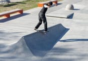 Backside lip slide on the door stopper at West Des Moines Skatepark in Iowa