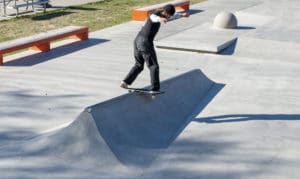 Backside lip slide on the door stopper at West Des Moines Skatepark in Iowa