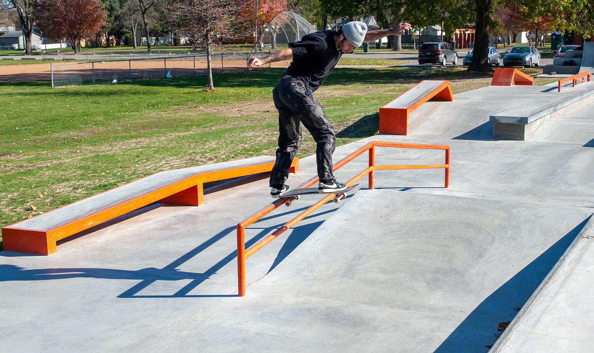 Backside tail on the A-Frame rail at West Des Moines Iowa Skatepark by Spohn Ranch