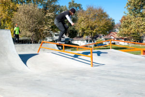 West Des Moines resident performs a Crooked Grind down the grind rail at the skatepark design and built by Spohn Ranch