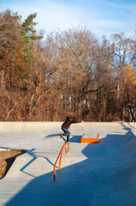 Frontside Feeble skatepark embedded in a forest designed and built by Spohn Ranch Skatepark Company