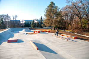 A frontside blunt side at a skatepark filled with Rails, Hubbas, Ledges, Transition, Volcano and tons of shade