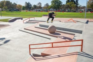 Flip Professional Matt Berger Switch Ollie over a bollard at La Puente Skatepark designed and built by Spohn Ranch