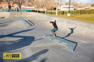 Cy Romano crooking his way down the long mellow flatbar at Victorville Skatepark designed by Spohn Ranch