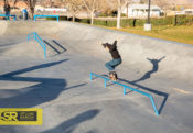 Cy Romano crooking his way down the long mellow flatbar at Victorville Skatepark designed by Spohn Ranch