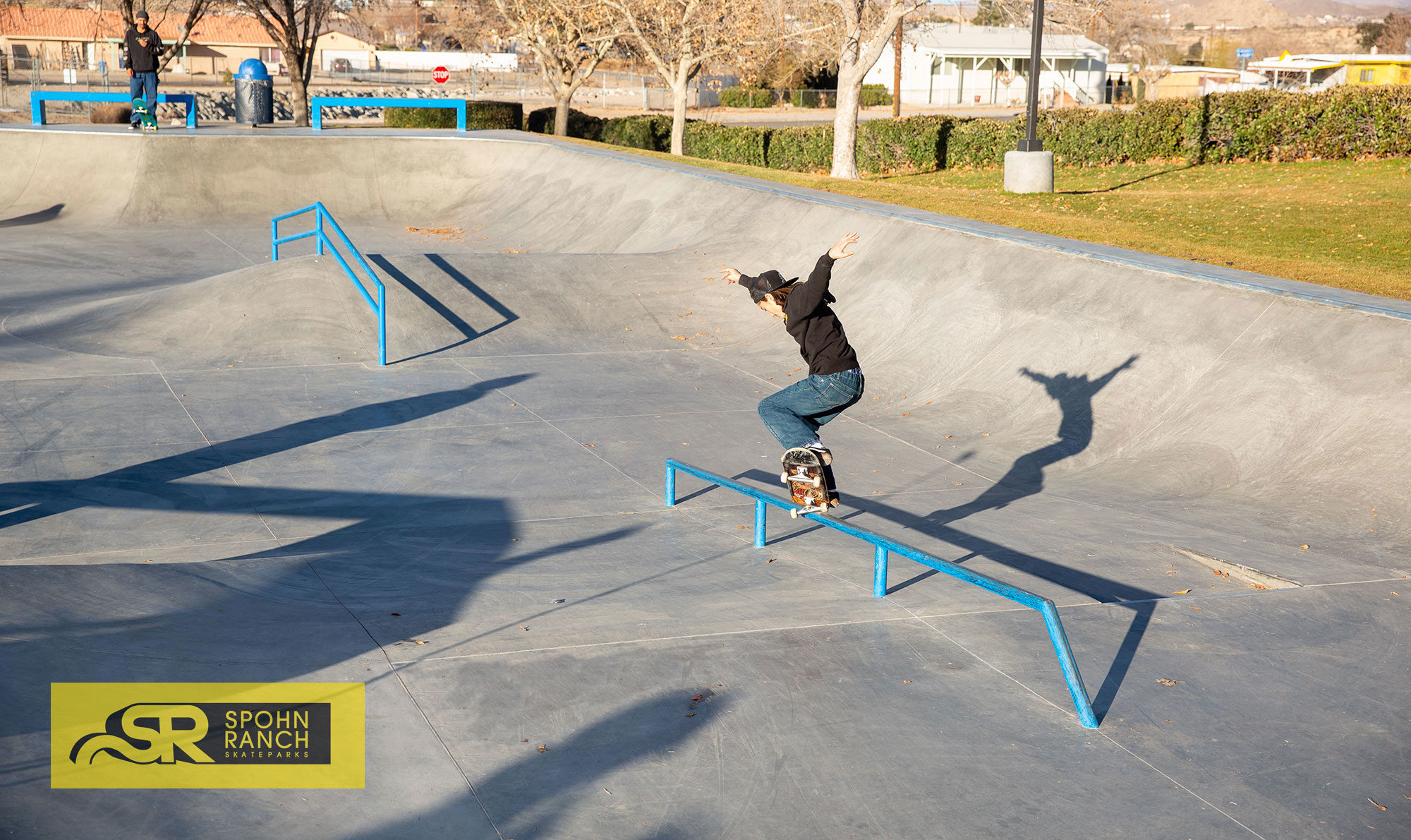 Cy Romano crooking his way down the long mellow flatbar at Victorville Skatepark designed by Spohn Ranch