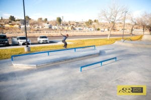 Zach Doelling nose grinding his way across the long square flatbar at Victorville Skatepark