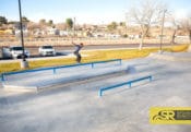 Zach Doelling nose grinding his way across the long square flatbar at Victorville Skatepark