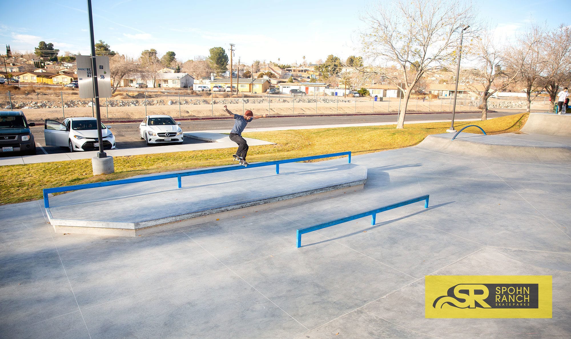 Zach Doelling nose grinding his way across the long square flatbar at Victorville Skatepark