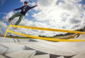 Frontside Boardslide up the handrail at a skatepark in Florida