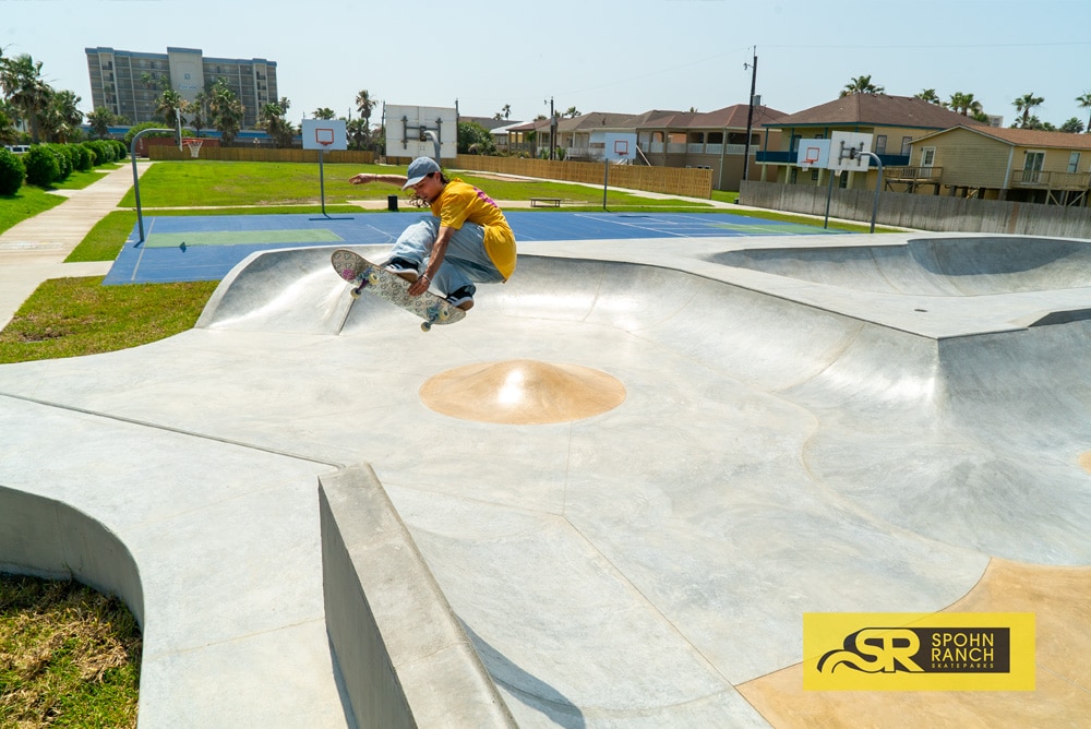 Mikey Whitehouse catching air at South Padre Island Skatepark in Texas, Built by Spohn Ranch Skateparks