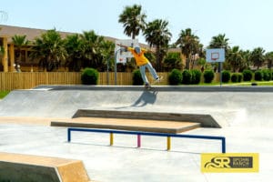 Backside 5.0 through the bank to ledge at South Padre Island Skatepark in Texas