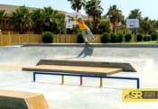 Backside 5.0 through the bank to ledge at South Padre Island Skatepark in Texas