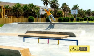 Backside 5.0 through the bank to ledge at South Padre Island Skatepark in Texas
