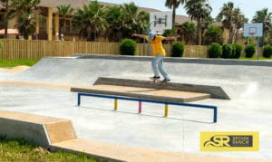 Backside tail across the manny pad by Mikey Whitehouse at South Padre Island Skatepark in Texas