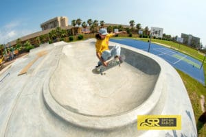 Mikey Whitehouse tucking knee at South Padre Island Skatepark built by Spohn Ranch
