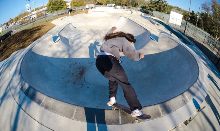Feeble grind around the pool coping at Allentown Skatepark