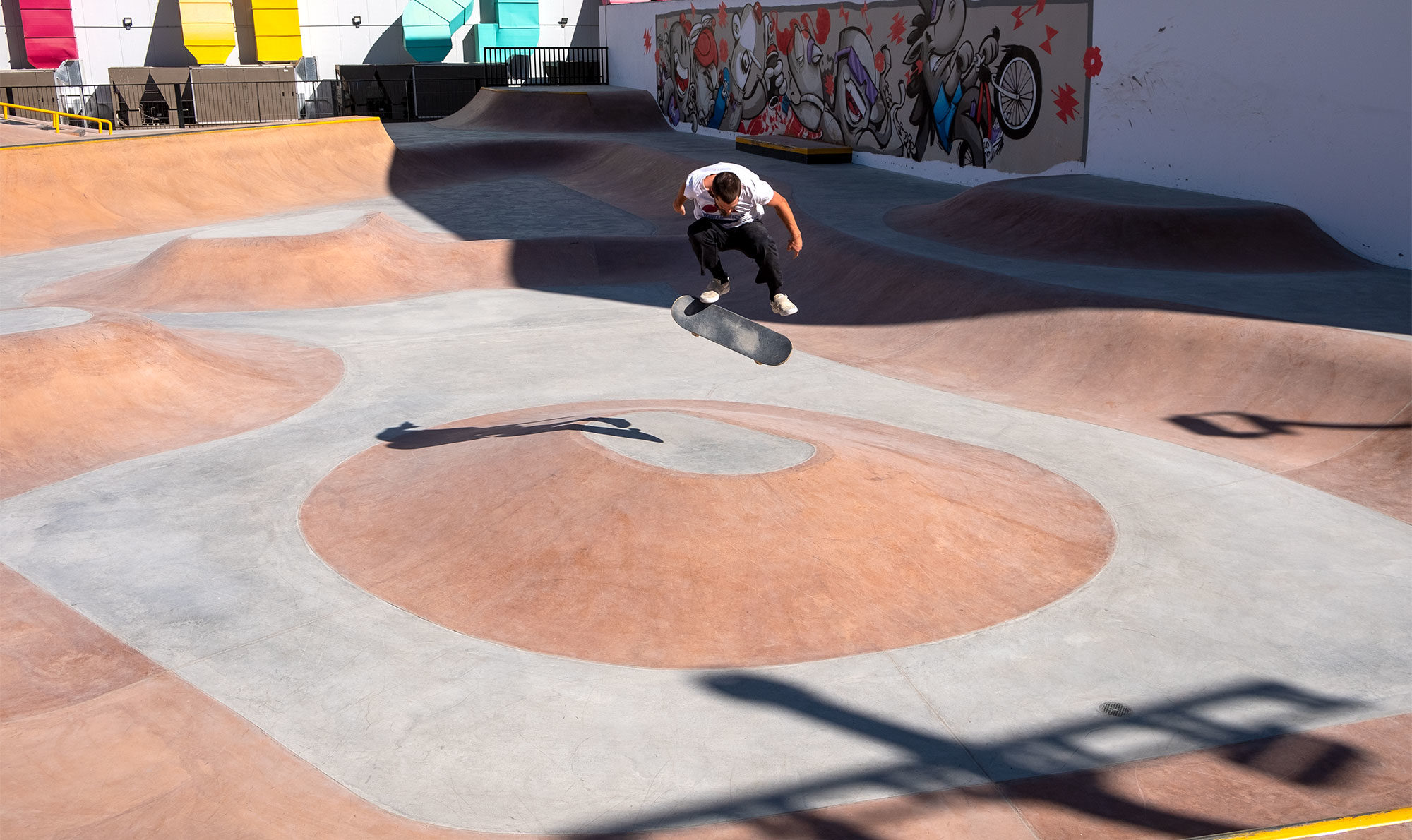 Kickflip over the bump at the Riyadh Skatepark in Saudi by Spohn Ranch Skateparks