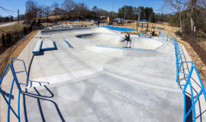 Carving the bowl extention at Spohn Ranch Skatepark design and build at Union City, GA