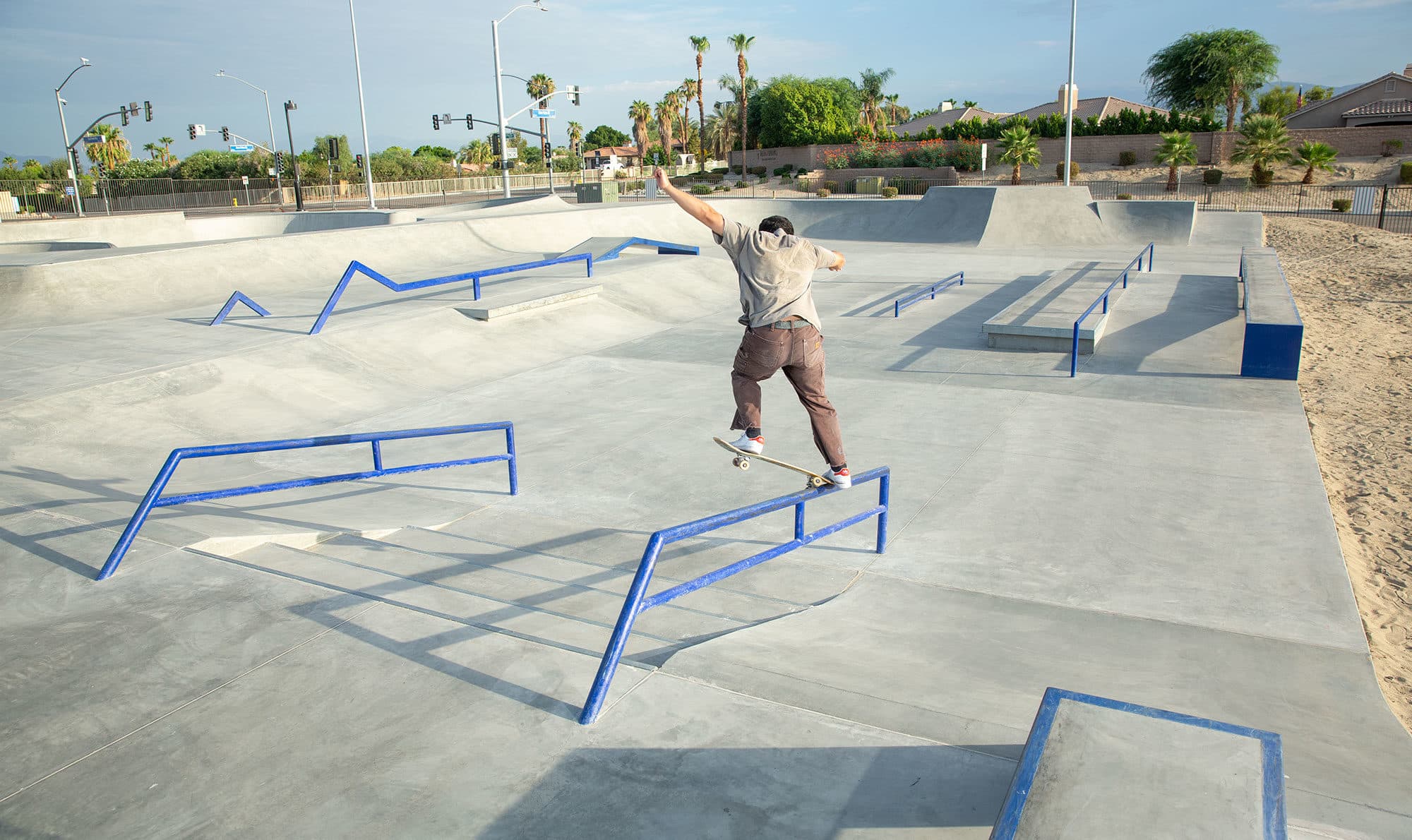 Crooked grind on the handrail at the La Quinta X Skatepark designed and built by Spohn Ranch