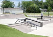 Cullman Skatepark's Manny Pad in Alabama with handrail and hubba in the foreground with a skateboard bowl in the back