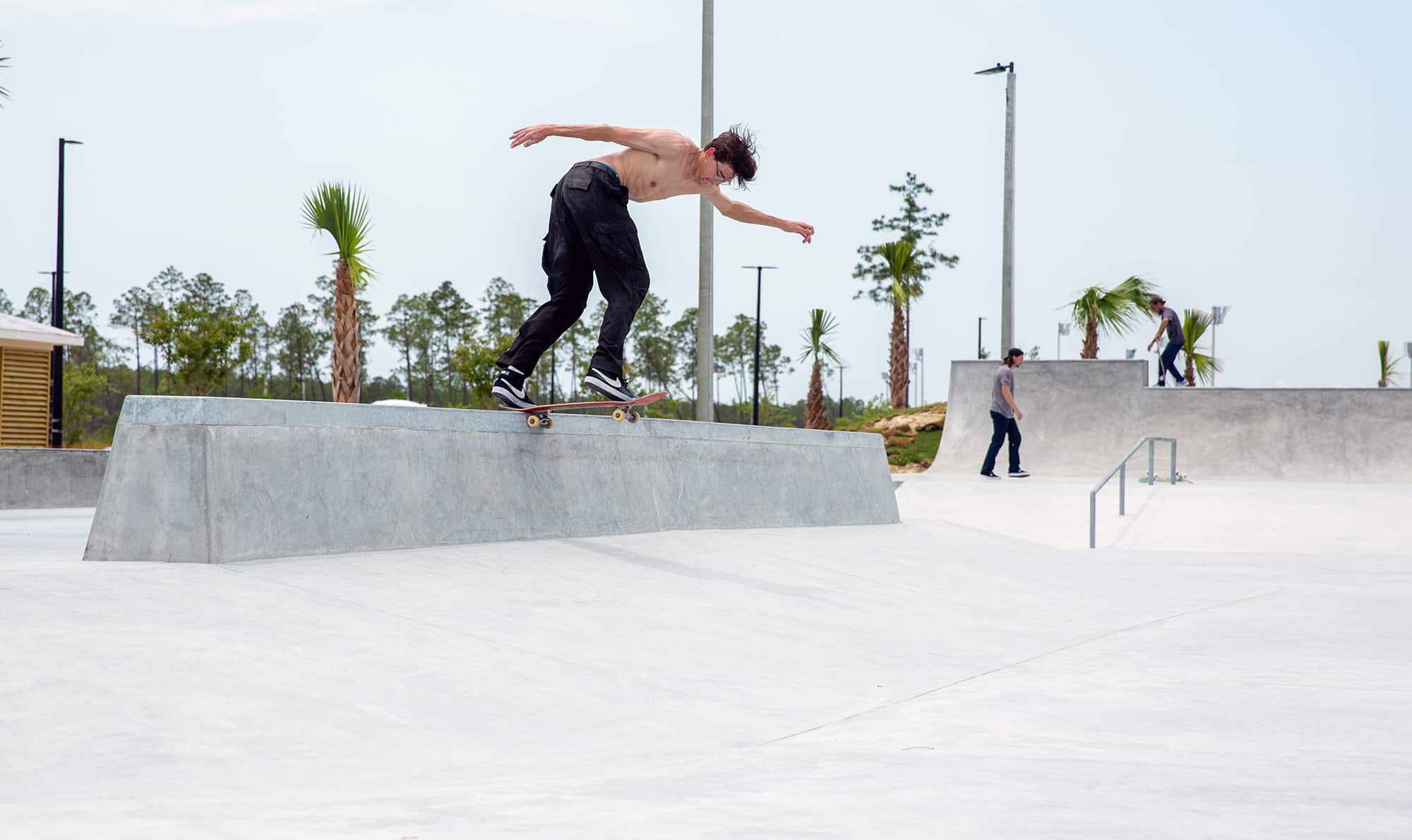 Backside tail on the tall bank to ledge at Panama Beach Florida Skatepark in Bay County